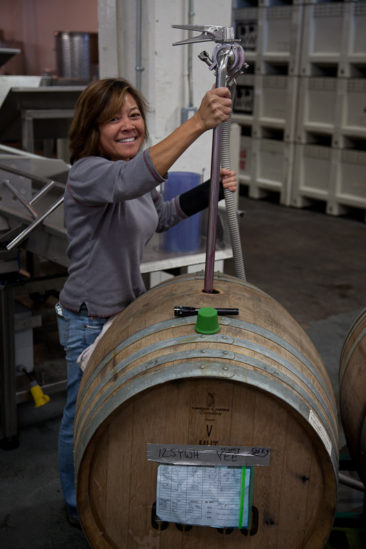 Mighty Yee pressing White Hawk Syrah